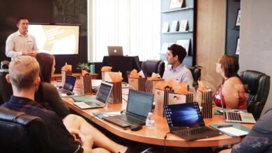 A team in an office discussing PSA software during a meeting